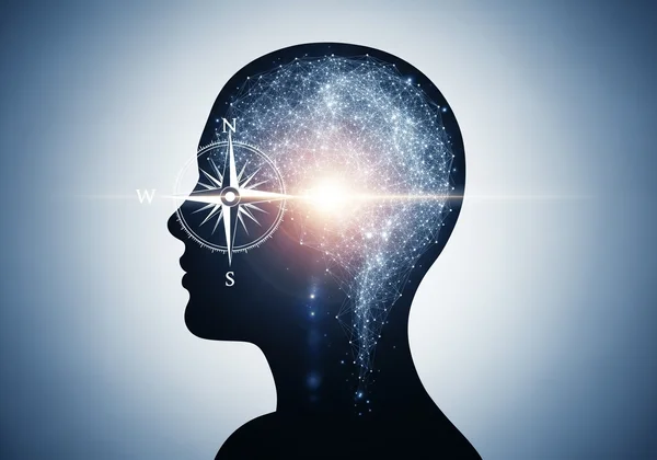 Person using a compass to navigate thoughts for self-understanding